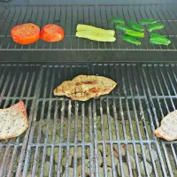 Snapdishの料理写真:Pork chops with a Montreal steak rub, jalapenos, and a tomato and cucumber sprinkled with sea salt and garlic powder.|Joseph Sandersさん