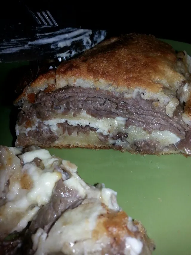 pizza dough rolled with roast beef, chix, meunster, and provolone, mayo and honey mustard.|Polly Gelfusoさん