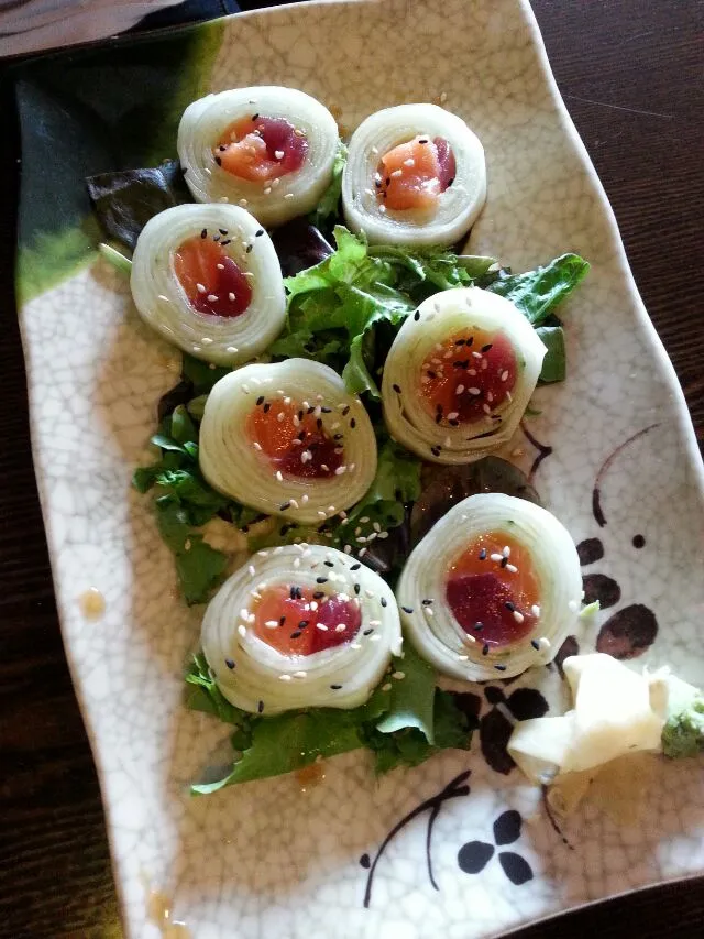 fresh sushi roll. cucumber wrap with tuna and salmon.|Polly Gelfusoさん