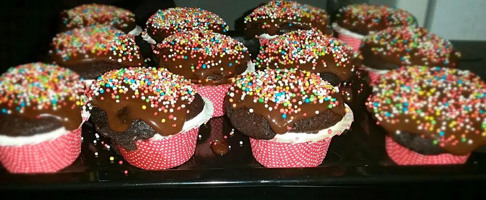 chocolate cupcackes topped with homemade choclate sauce and sprinkles|lolaさん