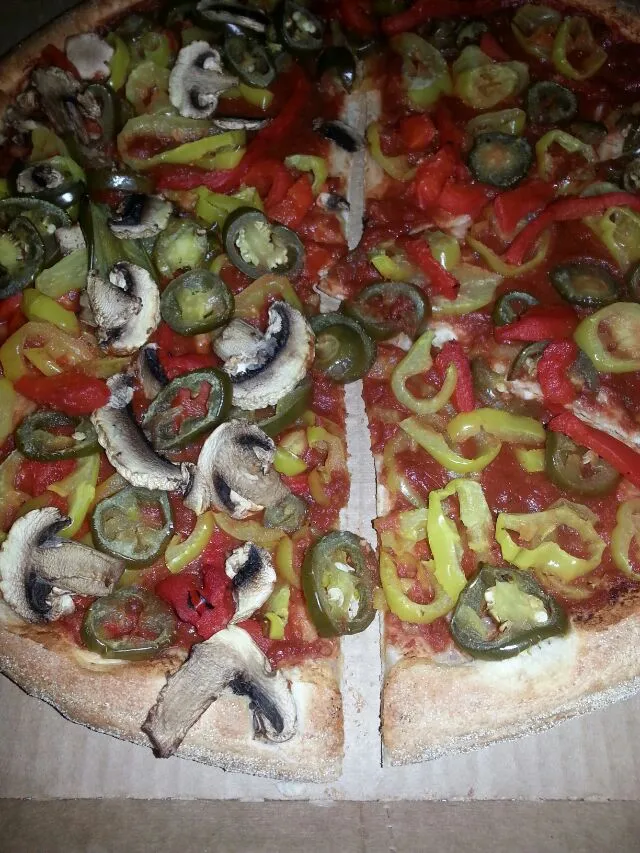 piazza with no chz, pickled jalapeños, banana peppers  roasted reds, and mushroom on half.|Polly Gelfusoさん