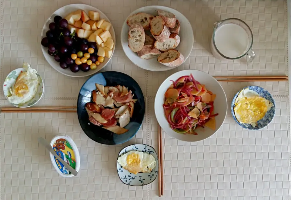 Snapdishの料理写真:Breakfast: fried sausage with mushroom, fried vegetables, baguette, fried eggs, fruit, soy milk mixed with milk.|Liciaさん