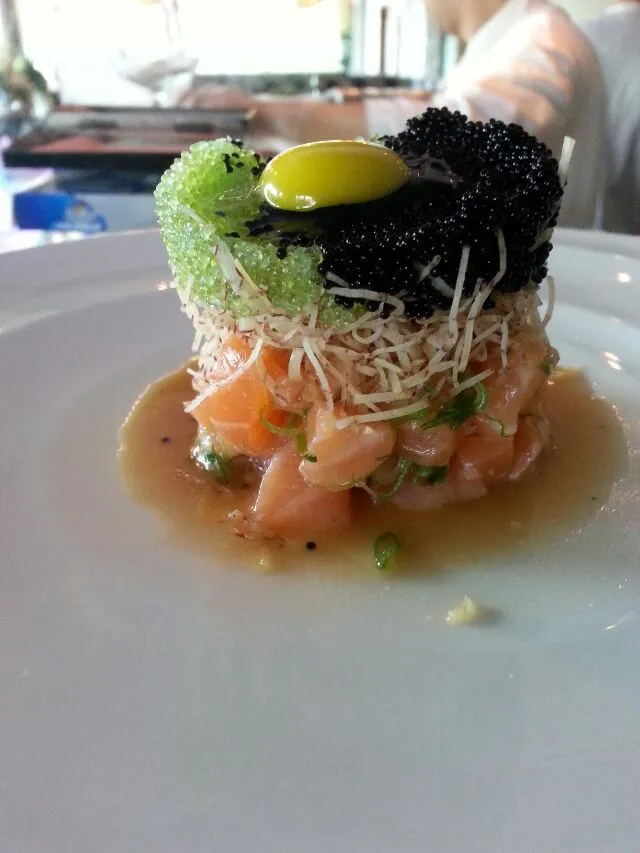 salmon tartar salad with quail egg and fish roe.|Polly Gelfusoさん