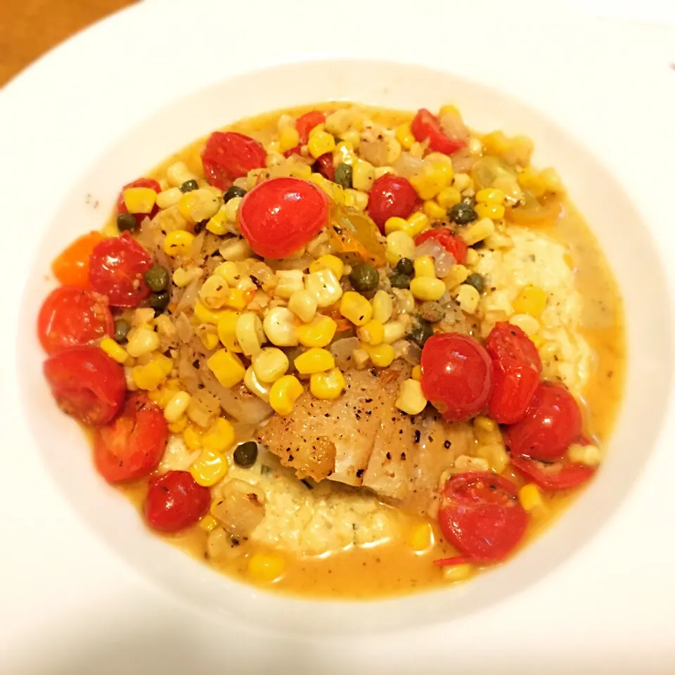 Snapdishの料理写真:Pan seared sea bass over cauliflower purée. Corn and cherry tomato maque choux.|West Coast Southernerさん