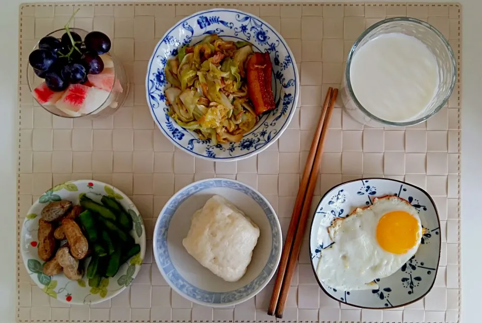 Breakfast: fried cabbage with stewed pork, fried egg, boiled peanuts and green soy beans, fruit cup( peach, pear, grape), steamed buns, milk.|Liciaさん