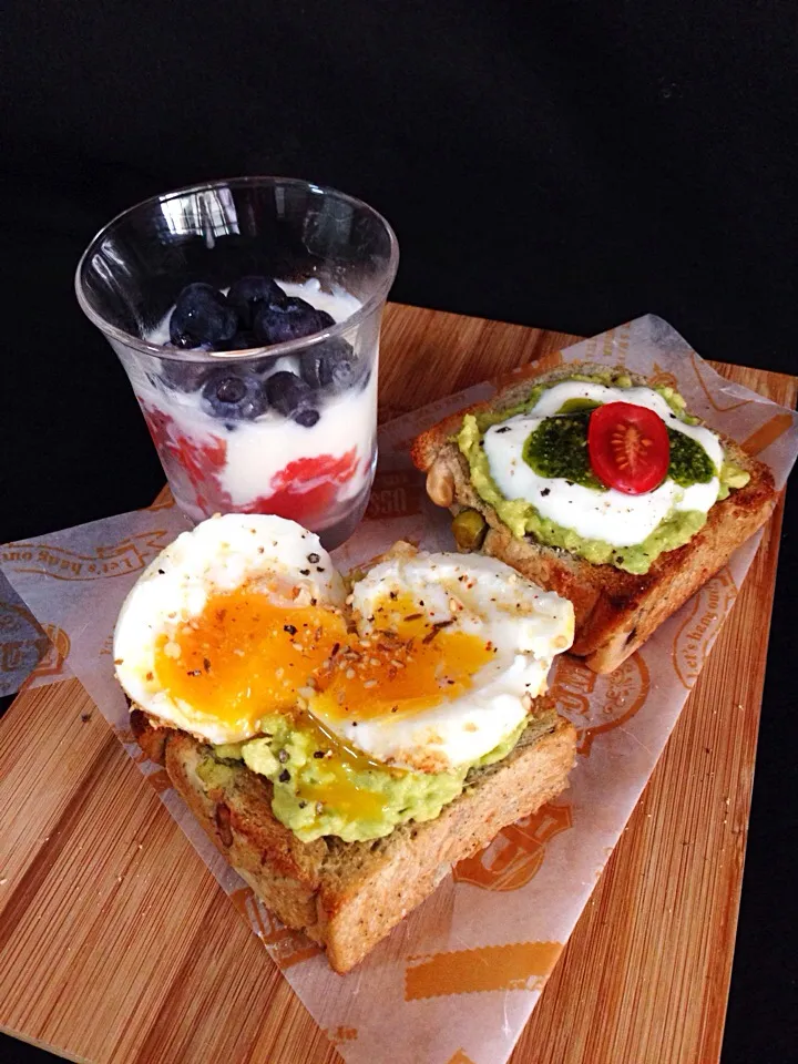 Snapdishの料理写真:Breakfast. Avocado toast with 1) soft boiled egg & dukkah    2) yogurt, pesto & cherry tomato. Yogurt with fresh fruits on the side|coxiella24さん