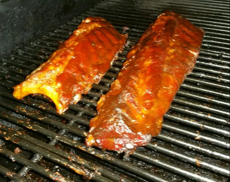 Snapdishの料理写真:Finished Product Baby back ribs smoked in hickory wood 5 hr cook time|Frank Ortizさん