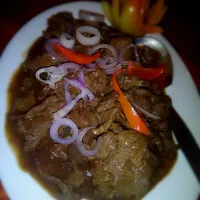 Beef Steak***thinly sliced beef cookd in soy sauce & lemon juice & garnished wth onion rings.|Enitsirhc Adamsさん