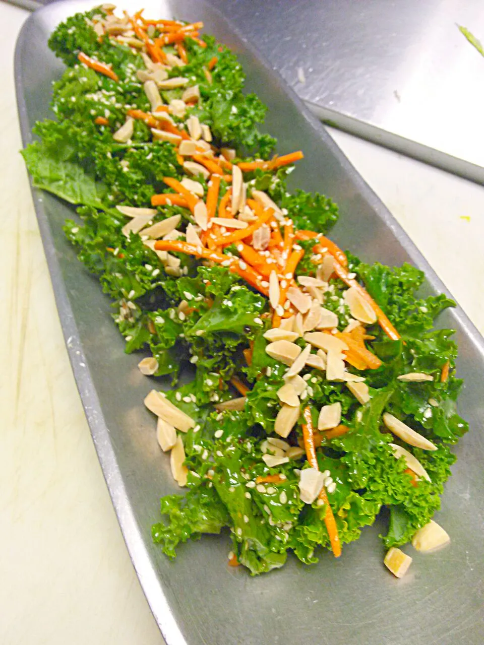 Kale salad, topped with carrots and roasted peanuts. Healthy and crunchy!|Chef-Jonathan TRさん