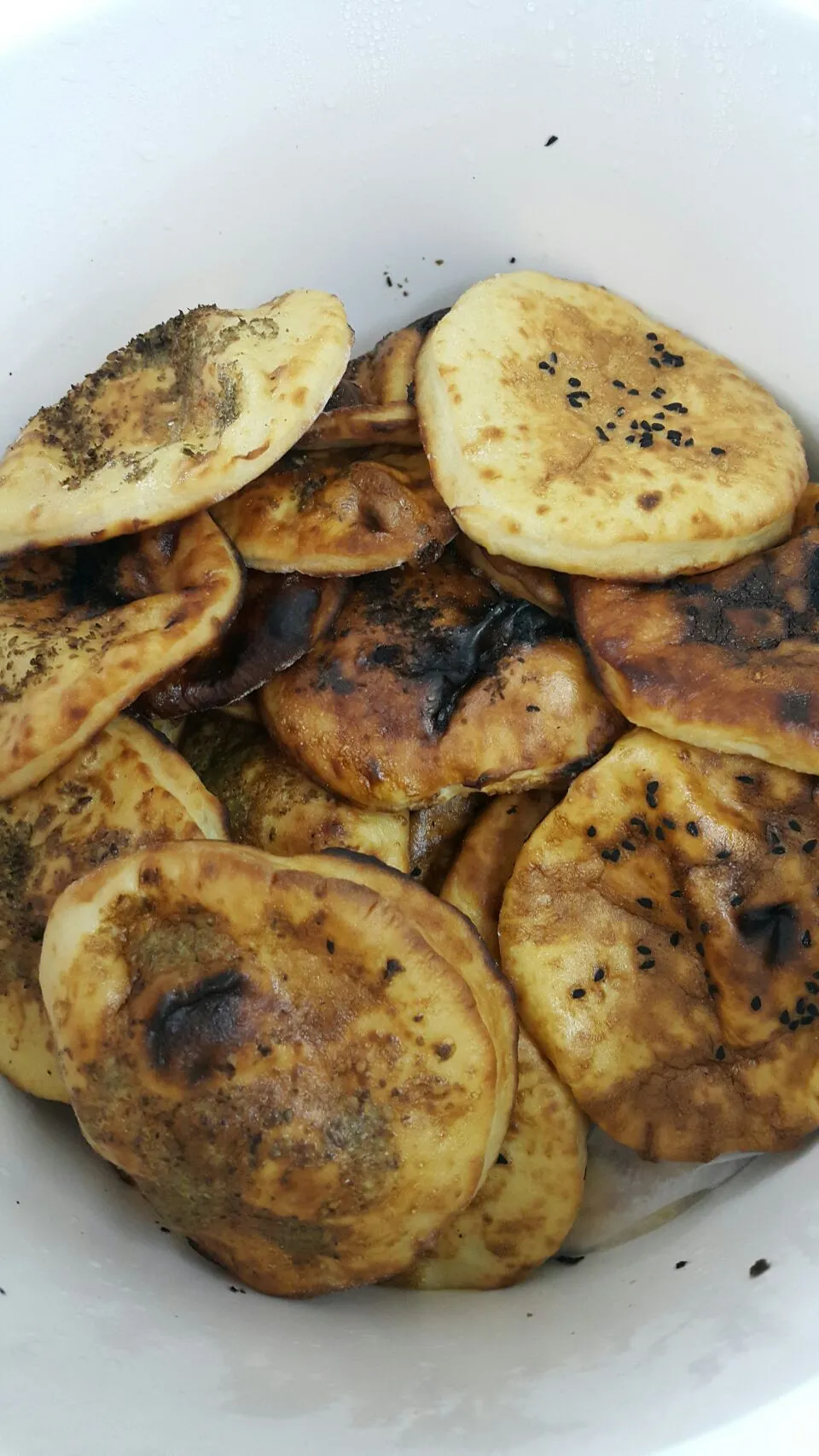 oven bread with sesame seeds and olive oil it's traditional dishes from East Coast united Arab Emirates|alnaqbeさん