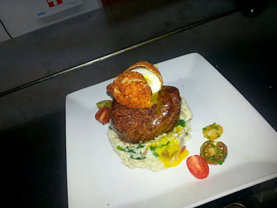 pan seared angus tenderloin with creamed spinach risotto and a parmesan crusted egg accompanied with a baby heirloom tomatoe salad|Jayson Mccrimmonさん