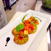 Heirloom tomatoes, watermelon compression, raspberry mint emulsion and feta cheese with balsamic reduction.|Joshua Robinsonさん