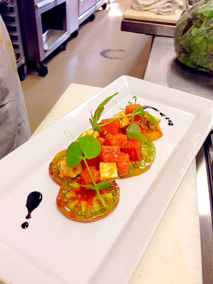 Heirloom tomatoes, watermelon compression, raspberry mint emulsion and feta cheese with balsamic reduction.|Joshua Robinsonさん