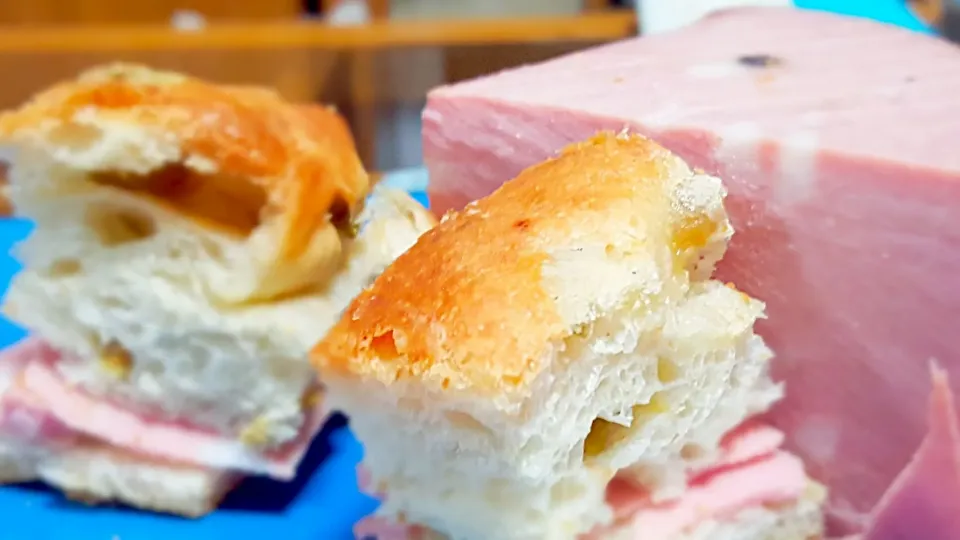 Snack. Olive bread focaccia style with mortadella. superyummy!|Li Jiaoさん