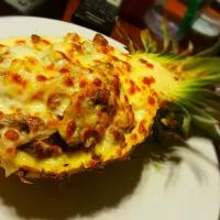 Snapdishの料理写真:steak, mushrooms, shallot, pineapple. all mixed in a pineapple cream sauce. stuffed in a pineapple with  mozzarella cheese|Michael M Schleyerさん