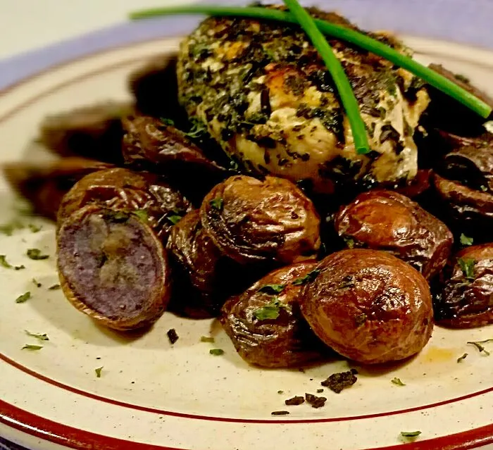 Healthy herb crusted grilled chicken on top of roasted purple potatoes. #cookingmybuttoff|Cooking My Butt Offさん