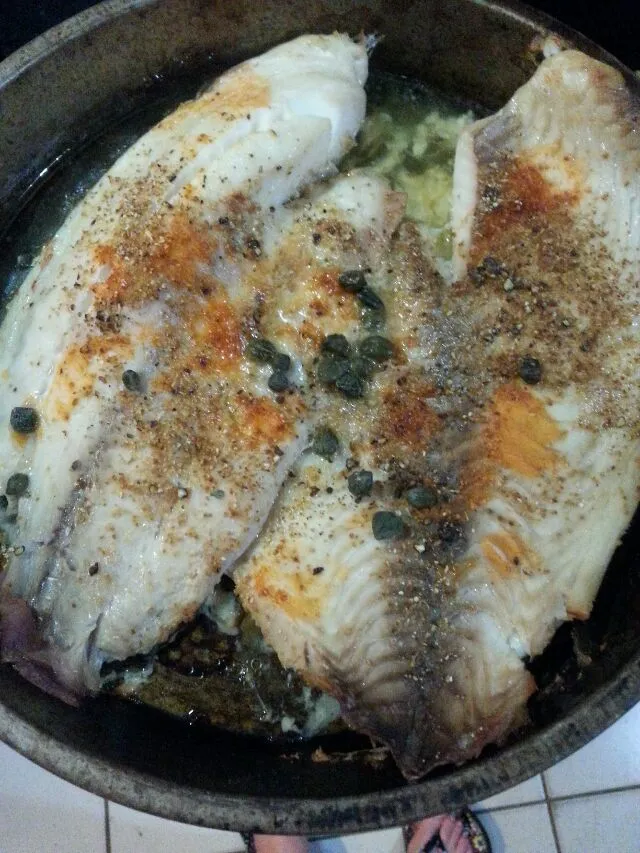 tilapia with capers, hot sauce, and butter.|Polly Gelfusoさん