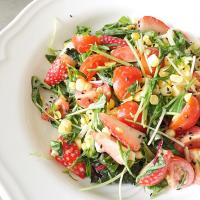 Mizuna, chard, baby spinach, corn, tomatoes and strawberries salad with sesame dressing