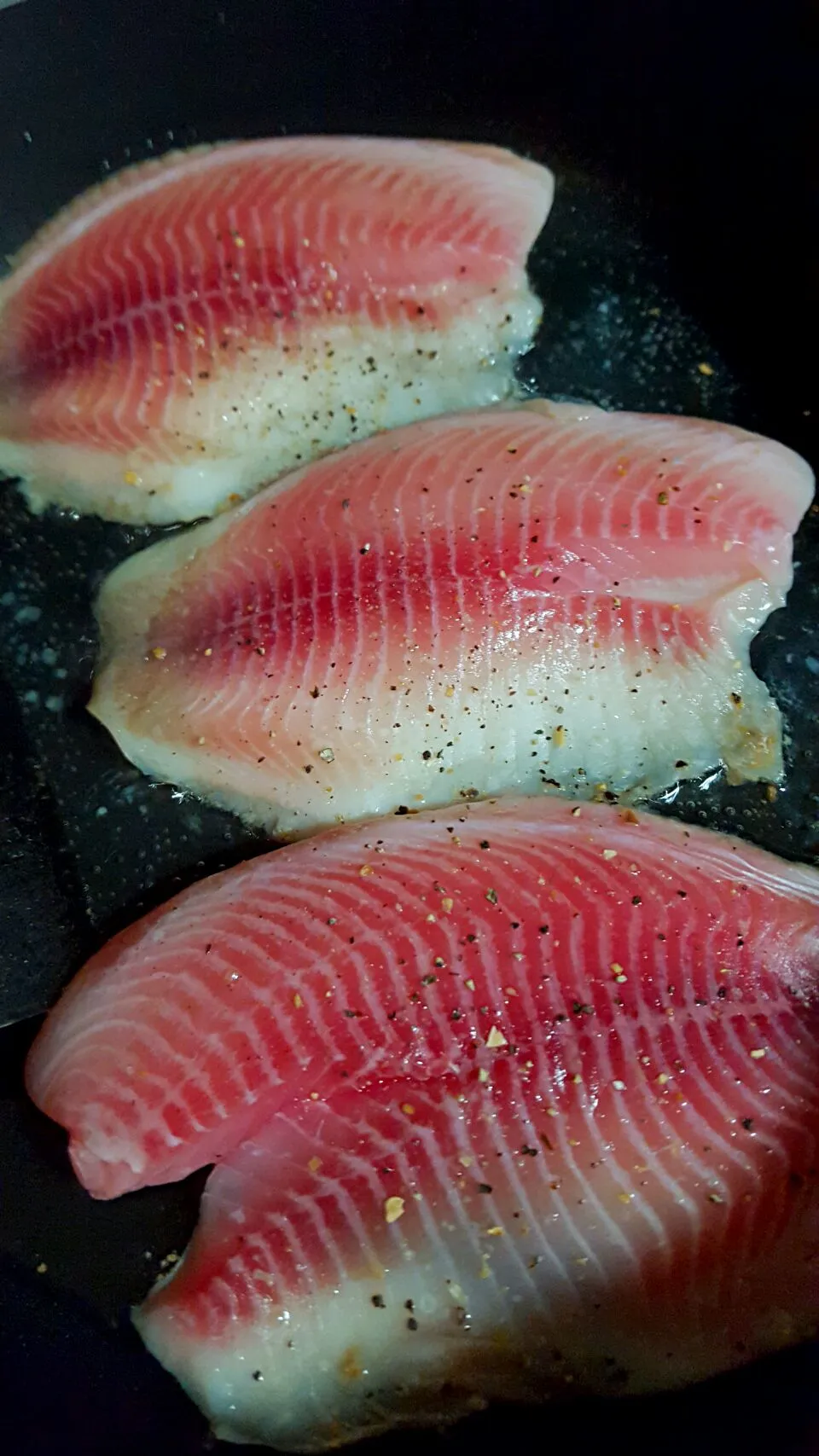 Pan-seared Tilapia in progress|Thebluestbutterflyさん