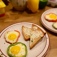 Eggs in pepper rings, fried with cooking spray, with a side of whole wheat toast and I Can't Believe It's Not Butter.|Cooking My Butt Offさん