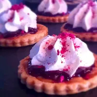 Snapdishの料理写真:Salted caramel tartlets, cherry jam, chantilly cream, freeze dried raspberries|Paul Macnishさん