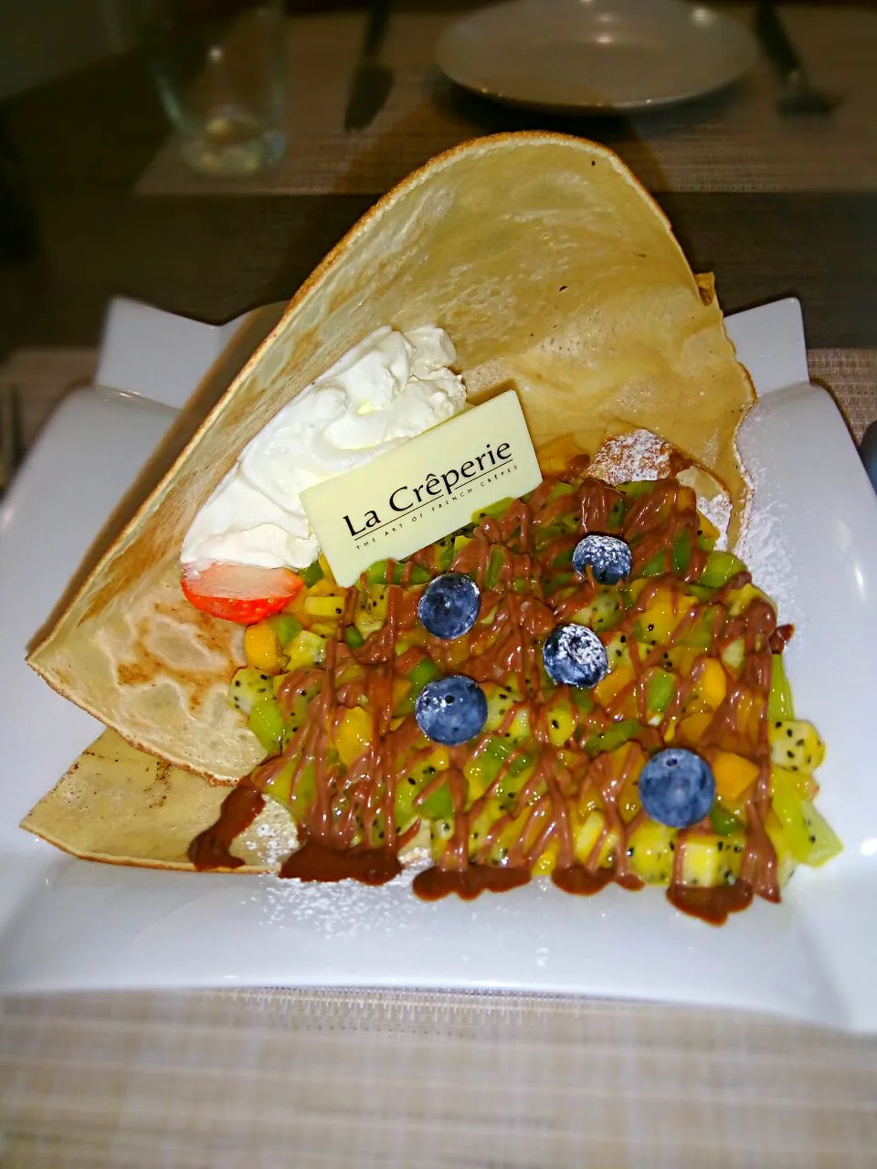 Snapdishの料理写真:The crispy crepes topped with fruit salad and soft chocolate. #frenchcrape|Punsharasさん