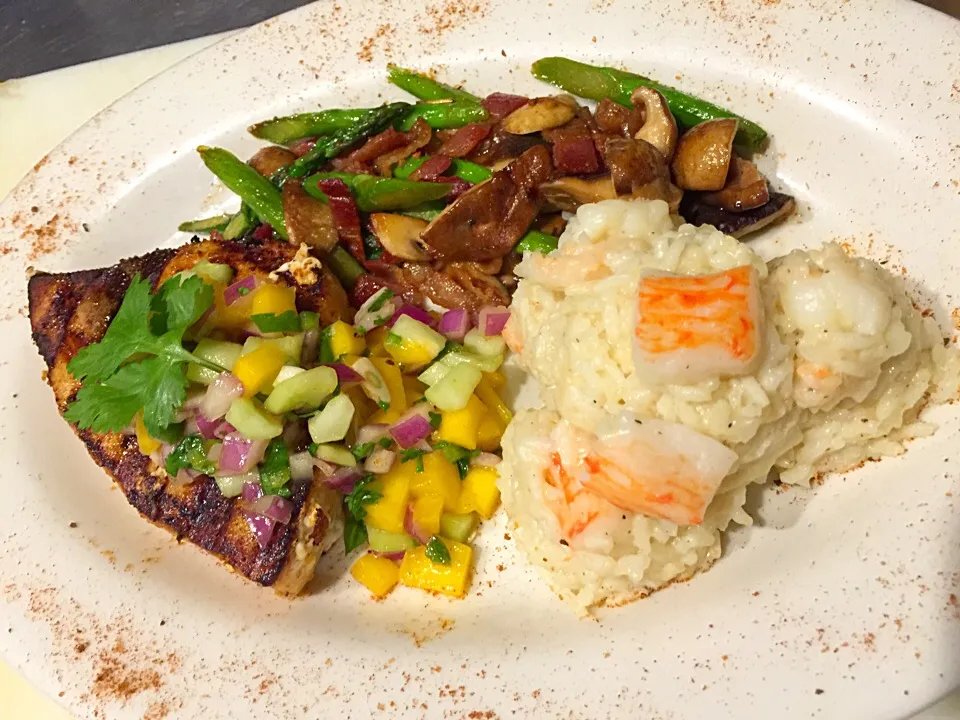 Snapdishの料理写真:Blackened Swordfish topped with Mango/Lime Chutney served with Seafood Risotto and Roasted Asparagus and Wild Mushrooms|Chef Ampさん