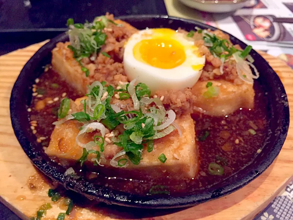 Sizzling tofu with half boiled egg|Sky Blueさん