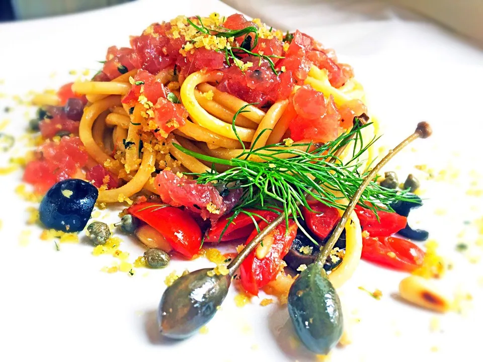 Bucatini Pantesca style,  raw Tuna tartare on top, caper fruits, wild fennel|laura giardinaさん