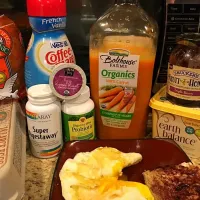 Meal One. Ezekiel toast and 2 eggs, 1/2 cup of coffee, carrot juice|Liz Martinさん