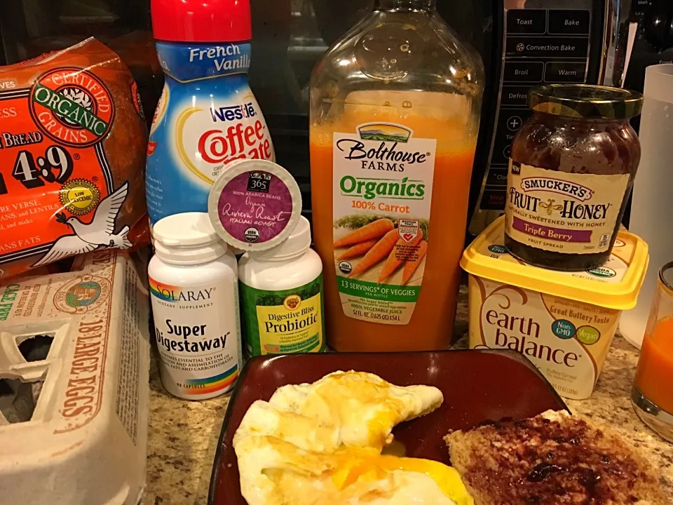 Meal One. Ezekiel toast and 2 eggs, 1/2 cup of coffee, carrot juice|Liz Martinさん