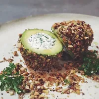 Stuffed avocado with herbed ricotta,coated with hazelnut...