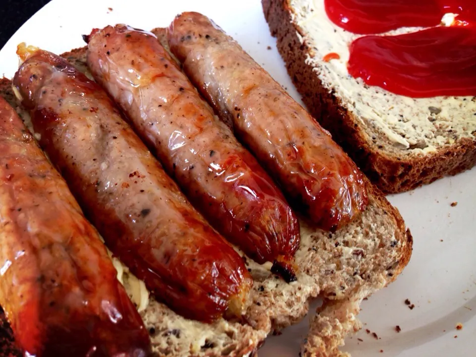 Cumberland sausage sandwich. Sausages On buttered granary whole meal bread & a dollop of tomato ketchup. Nom nom nom !|Karla Collington Ryderさん