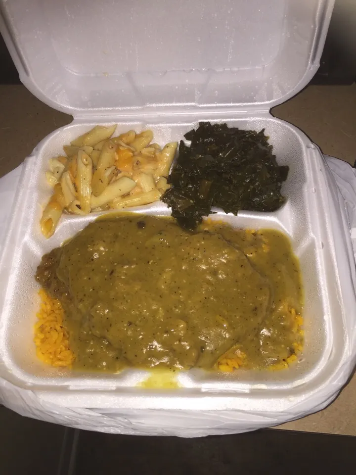 Smothered Pork chops over yellow rice, Collard Greens, Mac & Cheese|Richard Thompsonさん