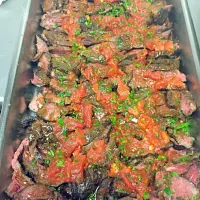 Sous vide hanger steaks. Sliced and served with a tomato basil salsa.|joe suegrimさん