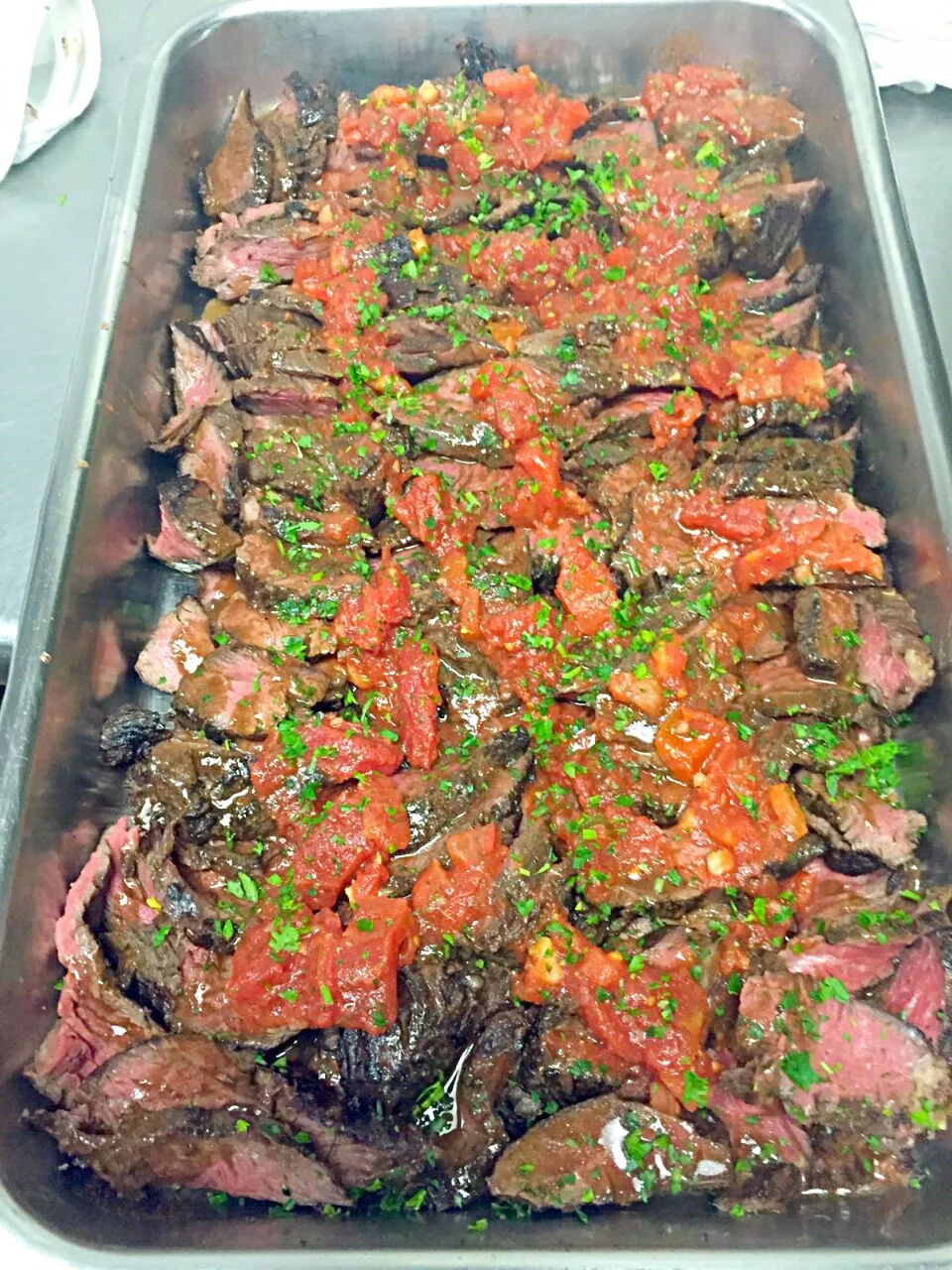 Sous vide hanger steaks. Sliced and served with a tomato basil salsa.|joe suegrimさん