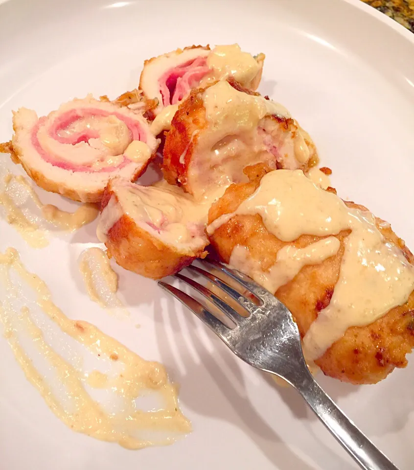 Chicken Cordon Bleu
Chicken breast, ham and Swiss cheese slices, breaded and sautéed. This yummy version adds paprika and a creamy white wine  sauce worthy of i|Alma's Home Kitchenさん