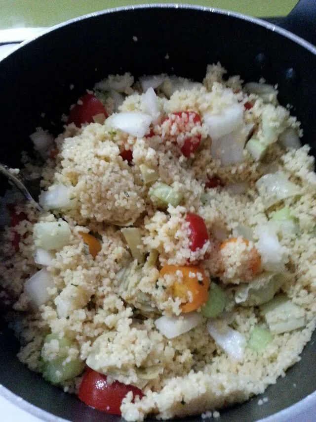 Snapdishの料理写真:boxed couscous jazzed up with artichoke hearts, tomatoes, onion and celery.|Polly Gelfusoさん