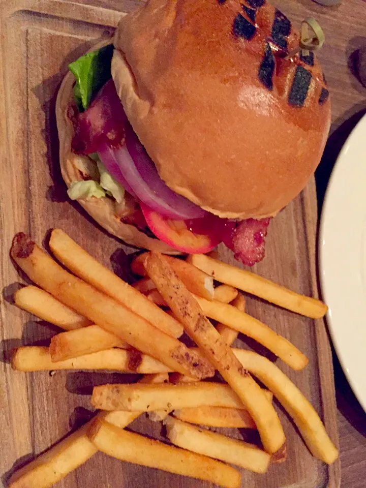 Snapdishの料理写真:Angus beef burger with smoked Apple wood bacon, Swiss cheese, caramelised onions, garlic aioli, fries, & a salad|Sky Blueさん