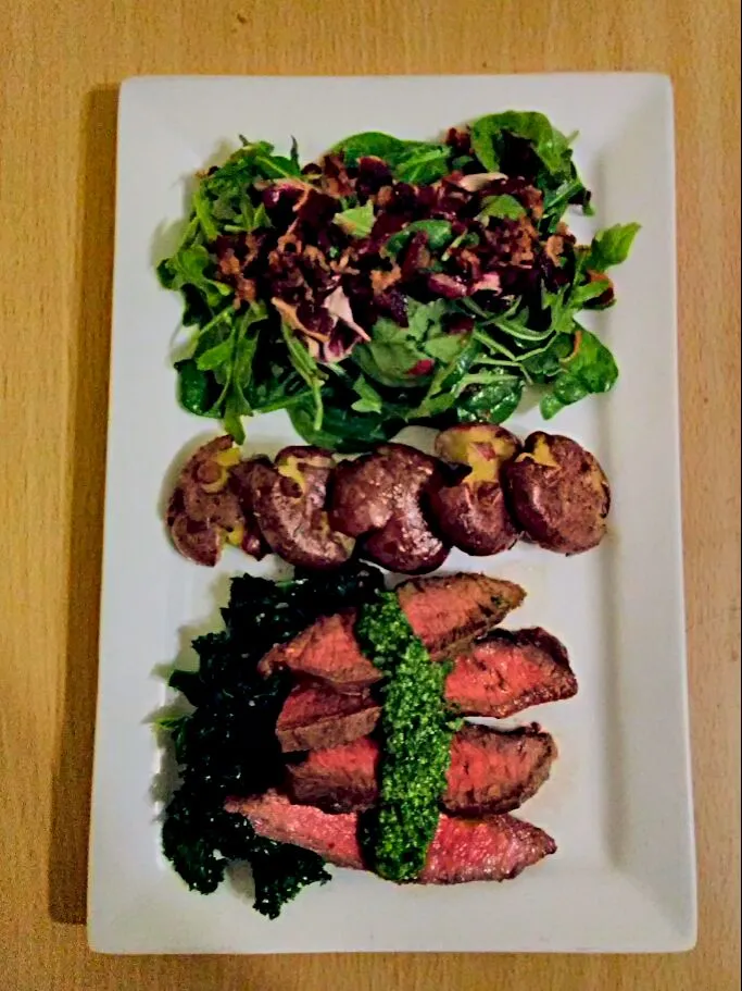 Pan-Seared Steak with Arugula Pesto. Served with Sautéed Kale, Roasted Smashed Potatoes, and a Green Salad with Bacon Honey Mustard Vinaigrette.|bethさん