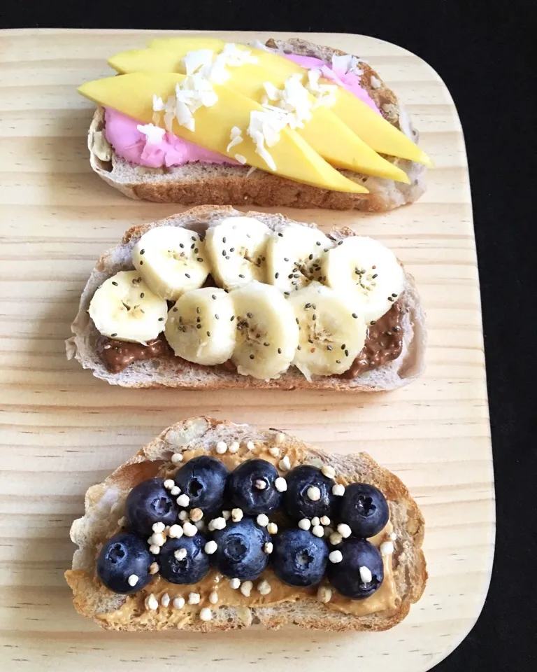 Snapdishの料理写真:Fruit toasts - mango with beet yogurt, banana with double chocolate nut spread, blueberries with peanut butter|coxiella24さん