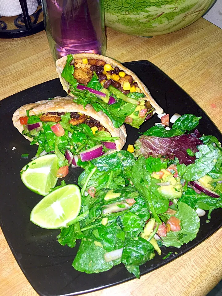 Snapdishの料理写真:Pita pockets stuffed with grilled taco lime chicken, black beans, corn and avocado salad with a side of avocado salad|amandaさん