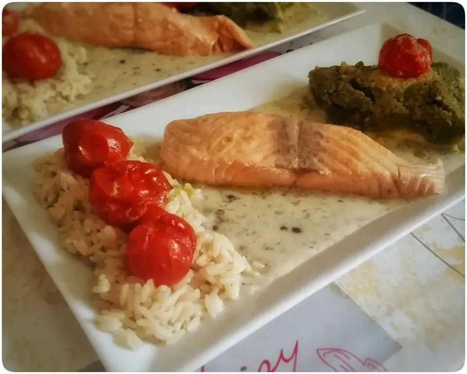 Snapdishの料理写真:"congierter" / in herbal oil slowly cooked Salmon Filet with wine cream herb sauce, rice and grilled cherry tomatoes

and

overbaked Pangasius Filet with crunch|Najeskaさん