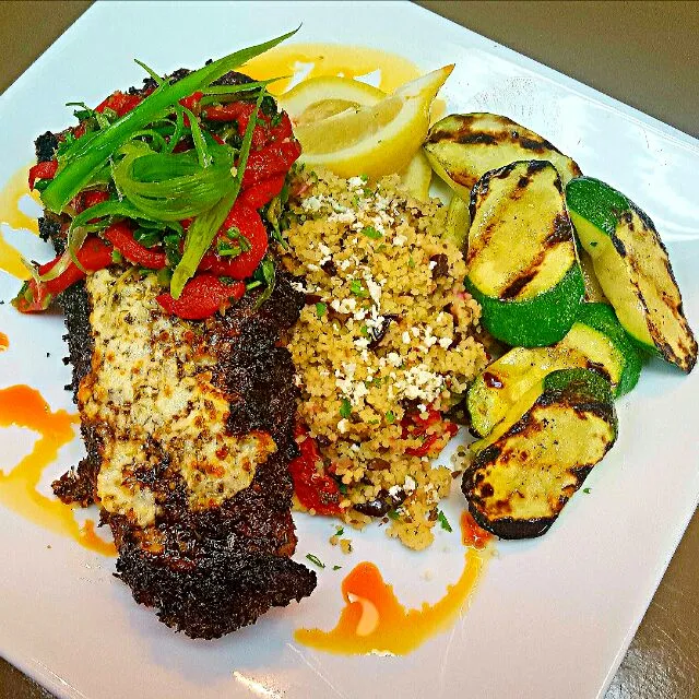 Greek style strip steak with feta cheese and marinated roasted red peppers,Mediterranean couscous and grilled zucchini|chef Charlesさん