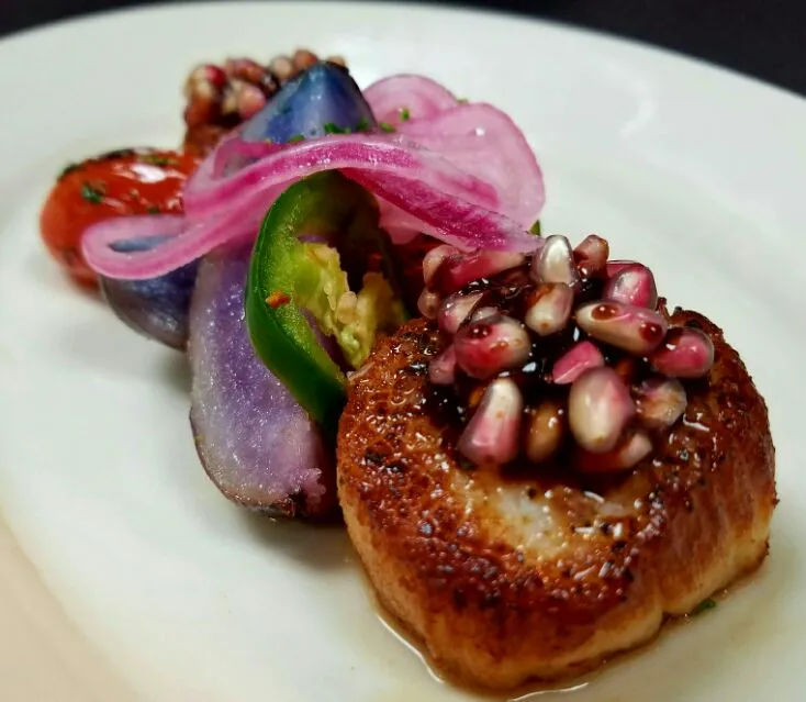 seared scallops with roasted purple potatoes,pickled red onions and jalapeños,topped with balsamic glazed pomegranate seeds...|chef Charlesさん