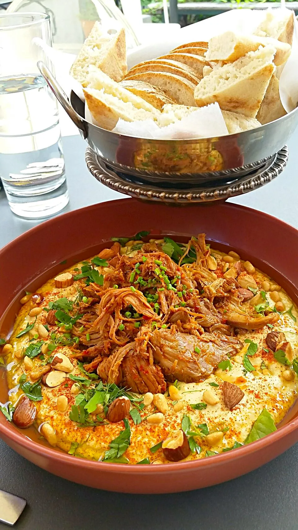 Hummus "Deluxe" with braised lamb and urfa pepper harissa for lunch.  It's delicious and big enough for 4 people to share. #stlouis #foodies #yummyfood #hummus |Jihollandさん