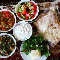 Delicious Armenian food. Great destination for #Vegetarians.  Here we have: Lavash bred with cheese and herbs. Tomato, cucumber salad with Thai basil. Yogurt wi|Amandaさん