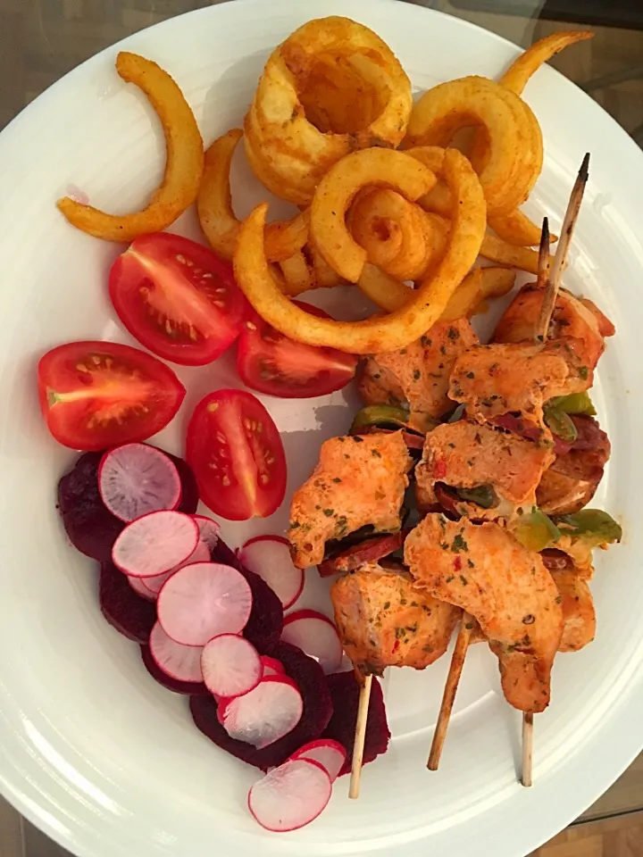 Chicken and chorizo kebabs with salad and curly fries|Ong Sor Fernさん