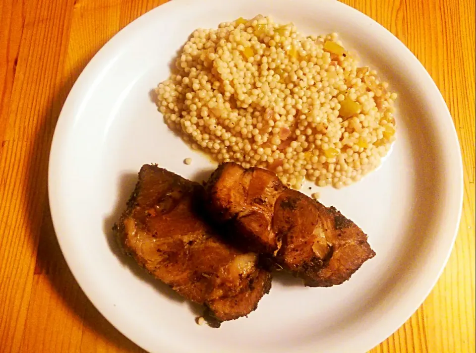 Garlic studded herb crusted pork, with Israeli couscous primavera.|Arpan Duttaさん