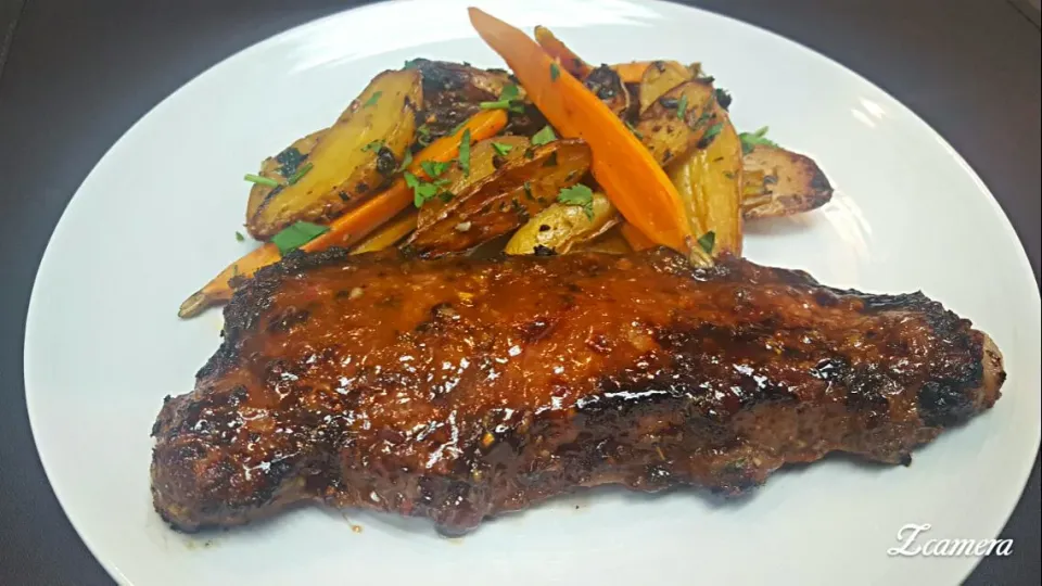 10oz soy ginger marinated and glazed new york strip with chili garlic fingerling potatoes and baby carrots...|chef Charlesさん